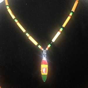 Beaded necklace with charm